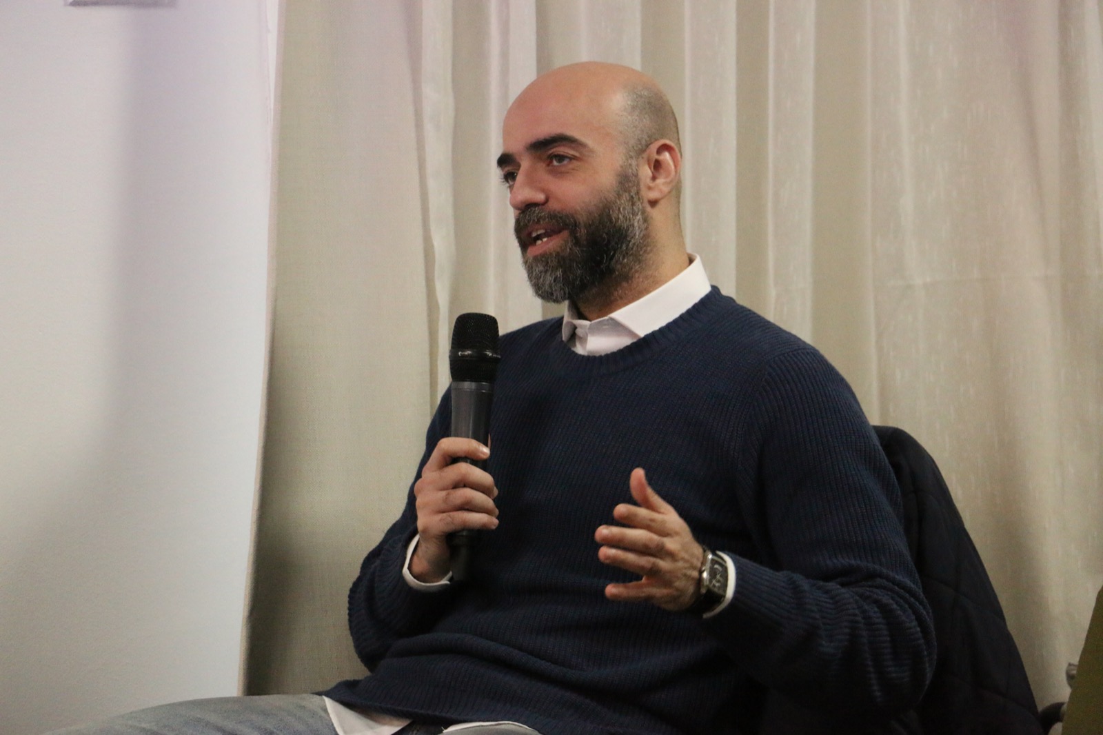 Ayman Samir speaking during a creative session